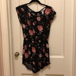 Flowered black romper w/pompom hem